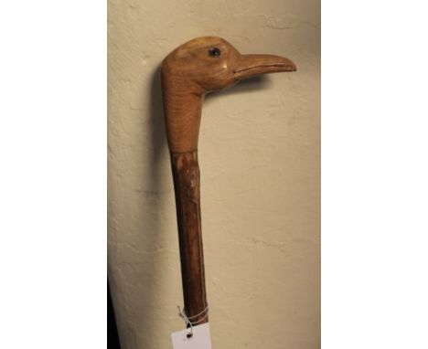 Rustic walking stick with carved terminal in the form of a duck's head. 