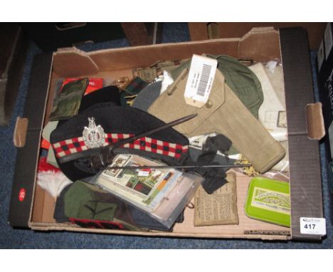 Box of assorted militaria items including regimental and RAF berets, webbing, pistol holster, helmet cover, beyonet, gaiters,