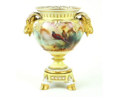 A Royal Worcester hand-painted twin handled pedestal vase Decorated with pheasants perching on a branch in landscape scene by