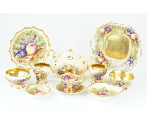 An Aynsley Orchard Gold pattern part serviceComprising teapot, two milk jugs, two sugar bowls, cup and saucer, twin handled b