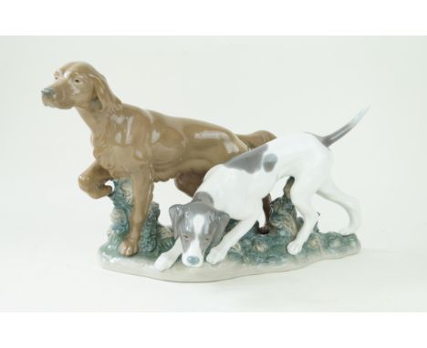 A large Lladro figure group Attentive Dogs, model number 4957G, produced circa 1977-1981, factory marks to base, height 26cm,
