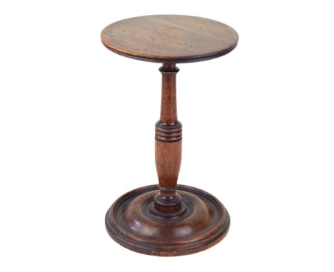 A Georgian mahogany candle standRaised on a single knop stem, height 22.5cm    CONDITION REPORT:  Diameter of top and base 14