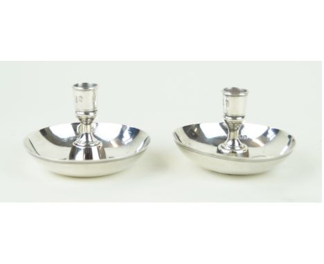 A Victorian pair of silver candlesticksOf plain circular form, with knopped stems, by Carrington & Co., London 1897, height 7
