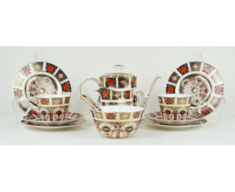 A Royal Crown Derby six setting tea service Comprising teapot, milk jug, sugar bowl with spoon, six cups, six saucers, six si