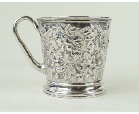 A Victorian silver mugProfusely embossed with vine and berry decoration, to a chased ground, the handled with a bark effect, 
