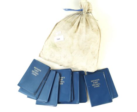 An unopened bag of British half pence value five pounds dated 28th March 1968In original canvas bag, further coins to include