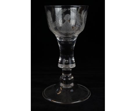 A Jacobean style clear wine glass With ogee shaped bowl, having engraved decoration depicting roses and portrait of a Georgia