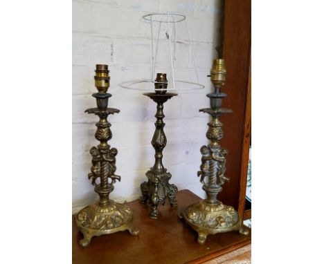 Lighting - a pair of early 20th century metal candkesticks converted to lamp bases; a 19th century French brass candlestick c
