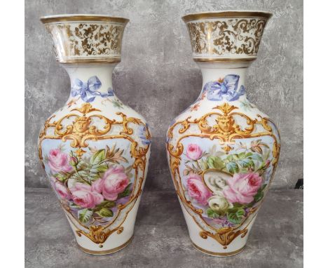 A pair of French large baluster shaped ceramic vases the main central panel hand painted with pink roses one with a framed pi