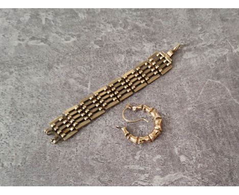 A 9ct gold part gate bracelet, stamped 375; a yellow metal hoop earring approx. 4.95g total 