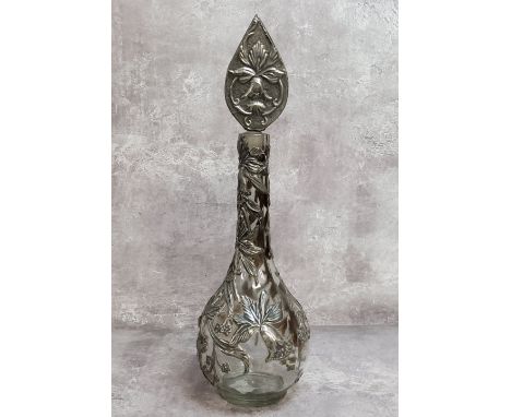 A period Art Nouveau globe and stem shaft vase decorated with sinuous pewter applied reliefwork decoration in the form of fox