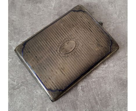 A continental silver cigarette case engraved &amp; chased decoration, scroll spandrels blue enamel border (losses), central o