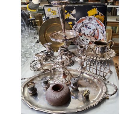 Silver plate including a two light twisted arm candelabra; another three light, a two handled tray, toast rack, etc. 