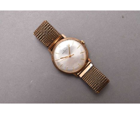Helvetia: A gentleman's 9ct gold wristwatch Date: Circa 1959 Movement: 17 jewel manual wind Dial: Sunburst silver, applied ba