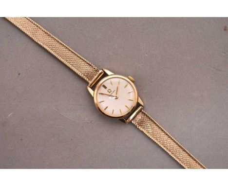 Omega: A lady's wristwatch with 9ct gold braceletDate: Circa 1965Movement: Jewelled manual windDial: Silver, applied baton ho