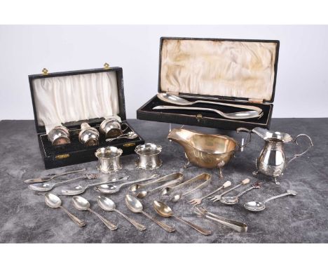 A cased three piece silver cruet set, Birmingham 1962-1965, comprising; a salt, pepperette and mustard with two spoons, toget