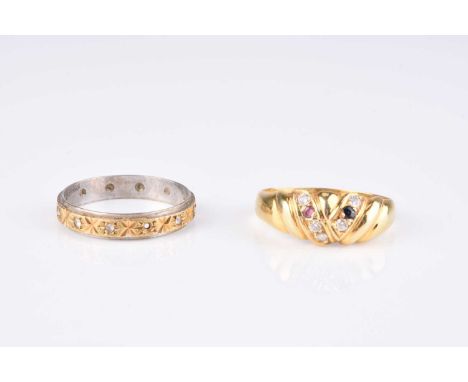 An 18ct yellow and white gold stone band, size Q ½, weight approx. 2.8g, together with a yellow metal ruby, sapphire and diam
