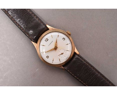 Garrard: A gentleman's 9ct gold wristwatchDate: 1961Movement: 17 jewel manual windDial: Silver, applied baton and Arabic hour