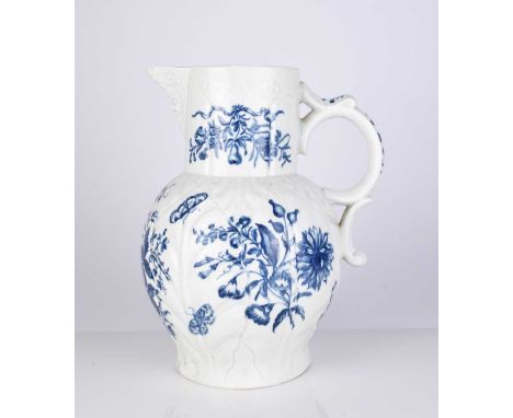 A large Worcester maskhead cabbage leaf moulded jug, circa 1775, transfer-printed in underglaze blue with the 'Pinecone' prin