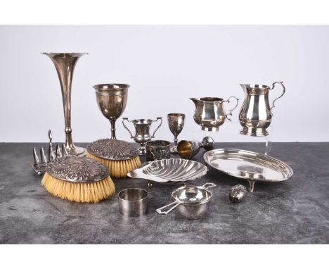 A small collection of silver, comprising; an oval teapot stand with engraved presentation to the centre, together with a gobl