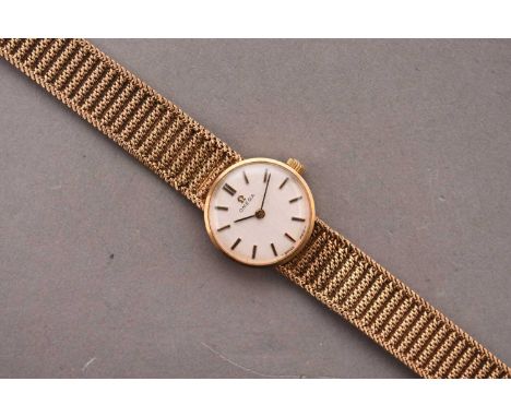 Omega: A lady's 9ct gold bracelet watchReference: 711.553.0Date: 1968Movement: 17 jewel Cal.620 manual windDial: Linen textur