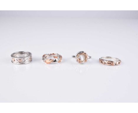 Four silver Clogau rings, comprising; a silver and gilt entwined oak leaf band, a silver and gilt band with vine decoration, 