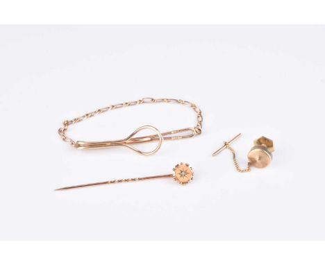 A rose cut diamond set stick pin, stamped '15ct', together with a 9ct gold tie slid, total weight approx 6.7g (2)