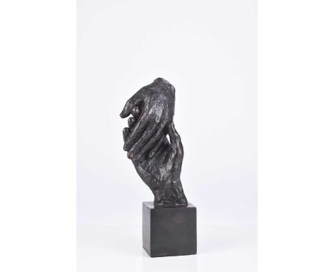 A 20th century bronze sculpture of hands, unattributedModelled as two hands touching, on a cuboid base.20cm high