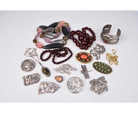 A small collection of costume jewellery, to include; a stone set white metal bangle, seven silver and white metal brooches, a