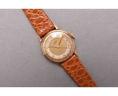 JenCo: A gentleman's 18ct gold wristwatchDate: Circa 1940Movement: 17 jewel manual windDial: Gold with silver chapter, applie
