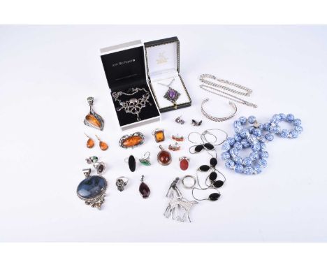 A collection of silver jewellery and costume jewellery, to include; an Art Deco style silver brooch in the form of a woman wa