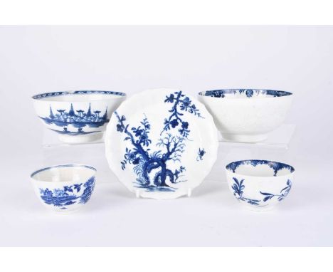 A small group of Worcester blue and white porcelain, 18th century, comprising a 'Prunus Root' saucer, of faceted form, 13cm d
