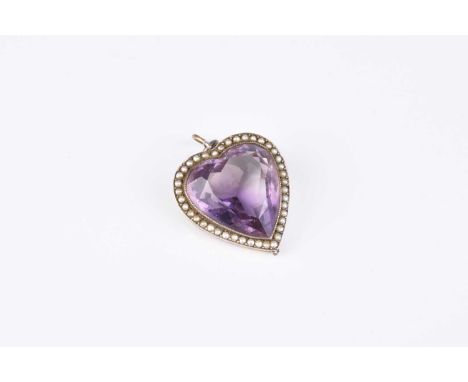 A heart shaped amethyst and split seed pearl set pendant, mounted in white metal, not stamped, 29mm long (excluding bail)