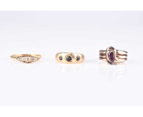 An 18ct gold graduated three stone sapphire ring, size P, together with a graduated five stone diamond ring, stamped '18ct', 