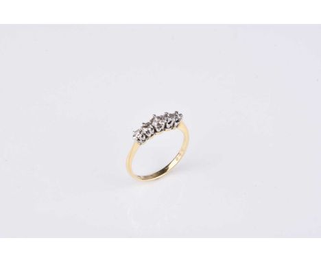 A graduated five stone diamond ring, the brilliant cut diamonds claw set in white metal to yellow metal shank, ring size P, s