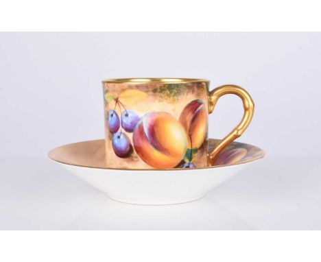 A Royal Worcester fruit-decorated coffee can and saucer by William Roberts, post-war, artist signed, gilt interior to the cup