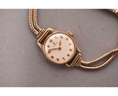 Omega: A lady's 9ct gold bracelet watchReference: 456.031Date: 1952Movement: 17 jewel Cal.244 manual windDial: Silver, applie