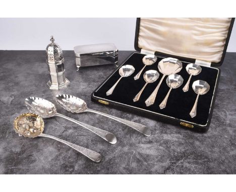 A small collection of silver, comprising; a cased set of fruit spoons, Birmingham 1935, together with an engine turned silver