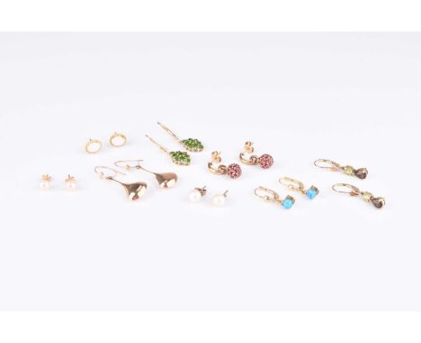 A collection of 9ct gold earrings, to include; a pair of ruby orb examples, a pair of cabochon opal examples and a pair of pe