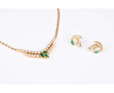 An emerald and diamond necklace, designed as a central cluster of three marquise cut emeralds mounted to two rows of graduate