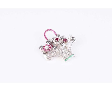 A diamond, ruby and emerald set giardinetto brooch, designed as a woven white metal wire work basket with channel set emerald