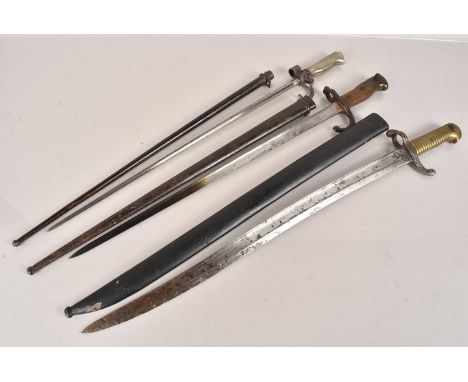 Three French Bayonets, comprising Yataghan, Lebel with cruciform blade and a Gras T-Back, all with scabbards (3) no postage f