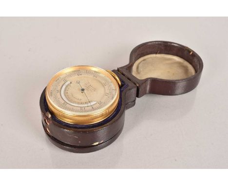A G.Saunders brass pocket barometer/compass, having silvered dial, complete with fitted leather case, with hinged lids to bot