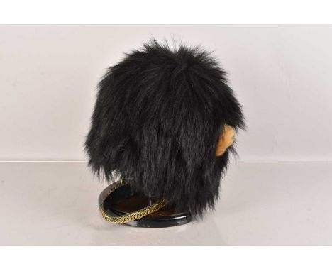A Vintage Bearskin Hat, having Don Speakes & Co  label to the inner, complete with white plume to the left and graduated leat