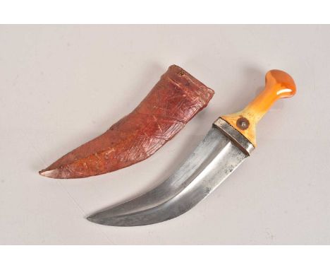 A Middle Eastern Jambiya/Khanjar, having polished bone handle with applied token, with 19cm long curved blade and scabbard, n