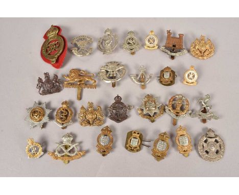 A collection of British Cap badges, including The Rifle Brigade, The King's Own Regiment, Royal Bucks Hussars, Duke of Cornwa