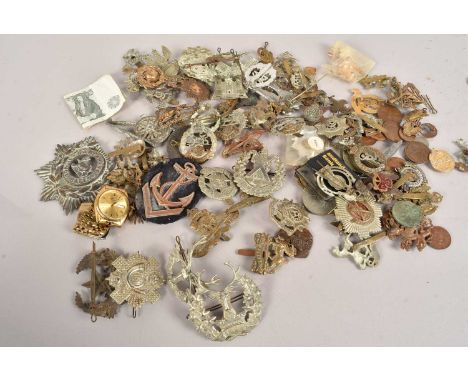 A collection of British Cap badges, to include Argyll and Sutherland, Hampshire Regiment, Inniskilling, Durham Light Infantry