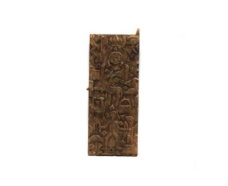 An African carved wooden door, having carved decoration, depicting a hunter with weapons and animals, with lock to the left s