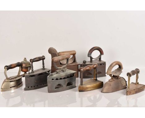 An assortment of vintage Irons, to include Coal Irons, Box Irons, a Coleman Instant Lite, trivets and more (parcel)