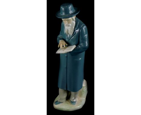 A Nao porcelain figure, of a Jewish gentleman holding a book, on a shaped base, paper label to underside no. 5050, 31cm high.